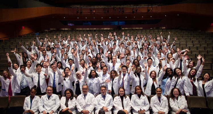 Medical Education’s faculty advisors pose with the new class.